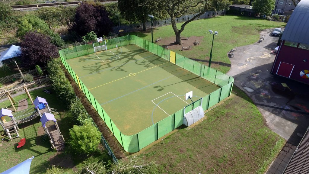 Large MUGA court with green fencing